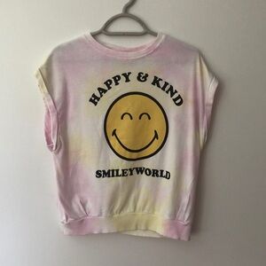Light pink smiley face shirt